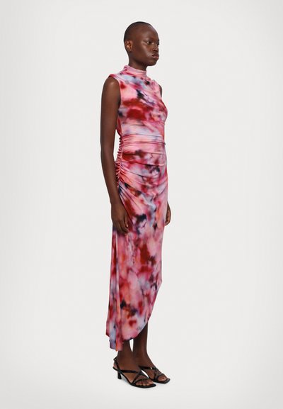 Form-fitting sleeveless dress in a pink and blue tie-dye pattern, featuring ruched detailing along the side, with a high neckline.