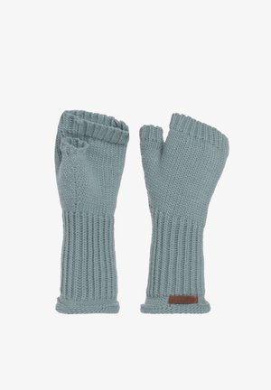 Gehaakte vingerlozen handschoenen in lichtblauw. Ribbelstructuur, lange manchet en bruin labeldetail. Gemaakt van zacht, elastisch materiaal.