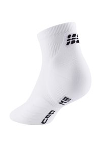 Calzino bianco alla caviglia con modelli e testo neri, che mostra un tricot texturizzato per ventilazione e supporto.