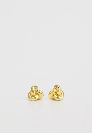 Gold-tone stud earrings featuring a twisted knot design. Smooth surface, round shape, and polished finish for a reflective look.