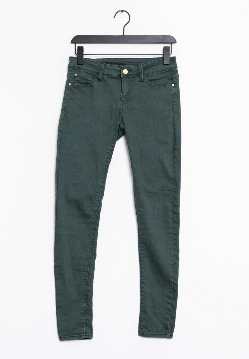 Jean skinny vert foncé en tissu mélangé coton, avec cinq poches et détails en métal doré.