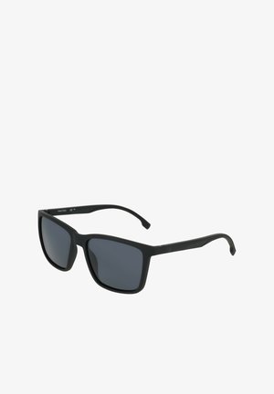 Black rectangular sunglasses with gray tinted lenses. Made from lightweight plastic, featuring sleek arms and minimal branding.