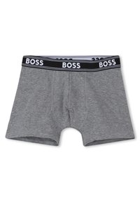 Cuecas boxer cinzentas para homem com uma cintura elástica preta que apresenta a marca "BOSS" em branco repetida à sua volta.