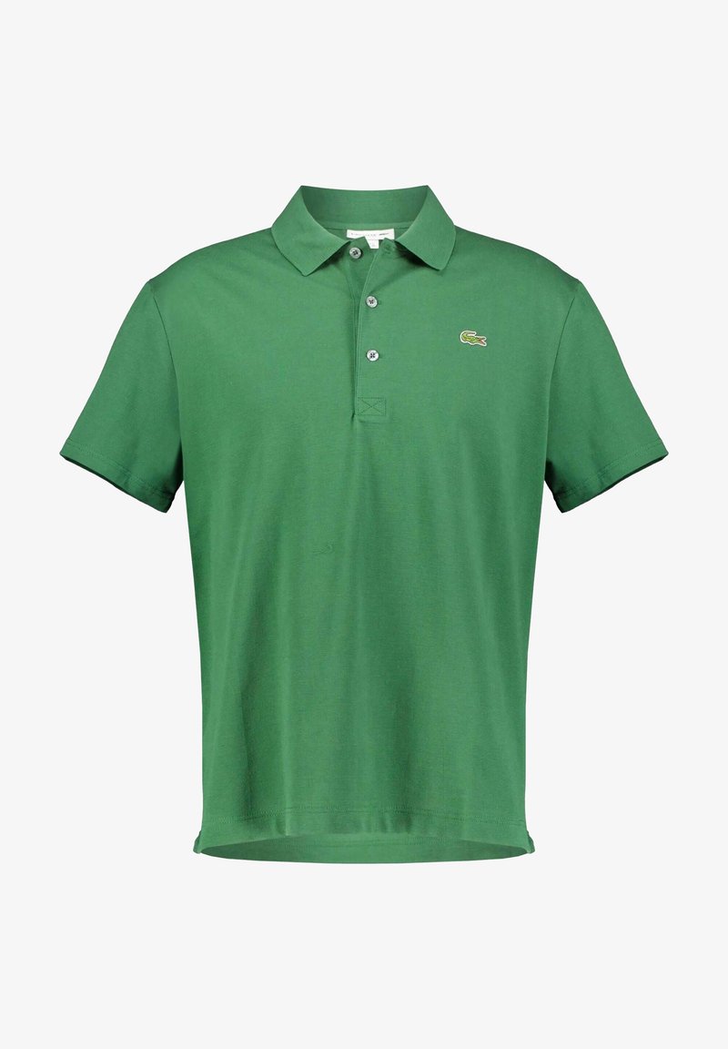 Green polo shirt made of textured cotton, featuring a classic collar, three buttons, and a small embroidered logo on the left chest.