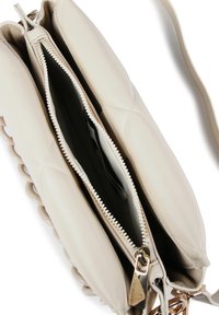 Light beige crossbody bag made of leather with two zippered compartments, quilted design, and gold-toned hardware accents.