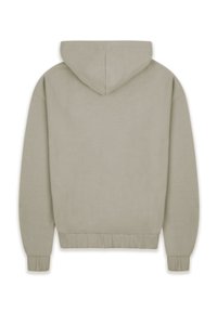 Hooded sweatshirt in light beige. Features a soft texture, ribbed cuffs, and a gathered hem. Minimalist design with no visible logos or patterns.