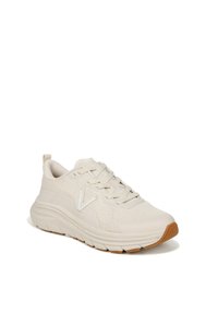 Light beige athletic shoe with mesh upper, rounded toe, flat laces, cushioned sole, and rubber outsole. Features embossed logo and textured details.