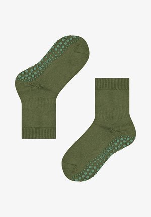 Olivgrüne Socken aus strukturiertem Stoff, mit einem gerippten Bündchen und Silikon-Grip-Punkten an der Unterseite für Rutschfestigkeit. Geeignet für den Innenbereich.