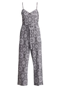 Combinaison à motifs noir et blanc avec bretelles spaghetti, corsage ajusté et coupe large, cintrée à la taille par une ceinture nouée.