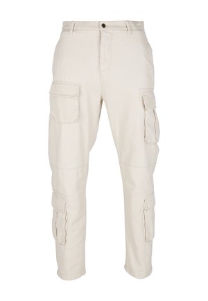 Bežinės kargo kelnės, pagamintos iš medvilnės. Yra kelios šoninės kišenės, tiesus kirpimas ir siuvinėti akcentai ant kišenių. Juosmuo su mygtuko uždarymu.