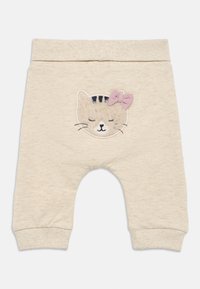 Hellbeige Baumwollhose mit einem gerippten Bund, versehen mit einem bestickten Katzengesicht und einer kleinen rosa Schleife auf der oberen rechten Seite.