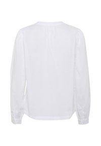 Camicia bianca a maniche lunghe con scollatura rotonda, caratterizzata da una vestibilità ampia e polsini bottonati. Realizzata in un tessuto leggero e morbido.