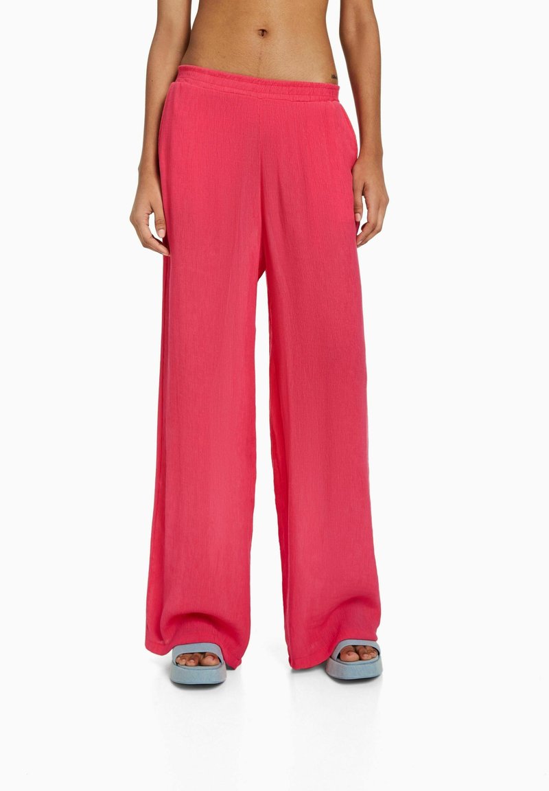 Bershka Kalhoty - coral