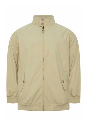 Veste beige zippée avec col montant fermé par deux boutons, manches longues, poches à rabat boutonnées, et poignets et ourlet côtelés.