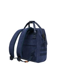 Navy corduroy backpack with leather accents, featuring adjustable straps, side pocket, and zip closure. Textured fabric and solid design.
