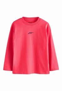 Ryškiai rožinė ilgam rankovė marškinė, pagaminti iš minkštos medvilnės. Yra apvalus iškirpimas ir mažas juodas logotipas atspausdintas priekyje.