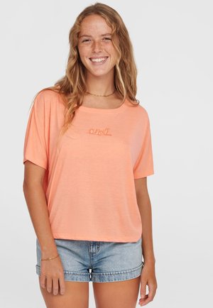 T-shirt a maniche corte e dalla vestibilità ampia in un arancione pastello, con un logo sottile in filo abbinato. Tessuto morbido con una caduta confortevole.