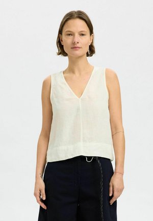 Haut sans manches de couleur claire en lin avec un col en V, un ourlet droit et un design minimal. Présente une coupe décontractée et une texture douce.