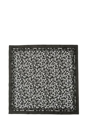 Black floral patterned square scarf with a solid black border. Made of soft fabric with detailed leaf designs throughout.