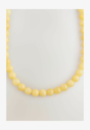 Gelbe Perlenhalskette mit glatten, runden Perlen und glänzender Oberfläche, die in einer durchgehenden Schnur auf einem neutralen Hintergrund angeordnet sind.