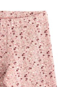 Rosa leggings med ett blommönster som har vinröda och vita blommor, mjuk tygtextur och elastisk midja.