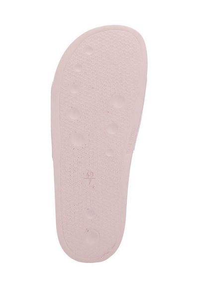 Suola in gomma rosa chiaro con superficie testurizzata caratterizzata da modelli circolari e esagonali, taglia contrassegnata come 40/7, progettata per garantire aderenza.