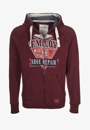 Felpa con zip di colore bordeaux realizzata in un mix di cotone. Presenta una stampa grafica, due tasche frontali e un cordino a contrasto sul cappuccio.