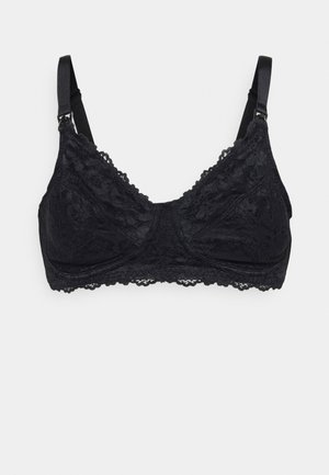 Bralette preto em renda com alças ajustáveis. Apresenta um padrão floral, bordas recortadas e um tecido suave para conforto. Design sem almofadas.