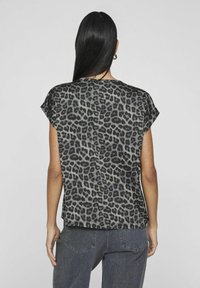 Short-sleeve, gray leopard print shirt with a relaxed fit and soft texture, showing a round neck and extending to hip length.