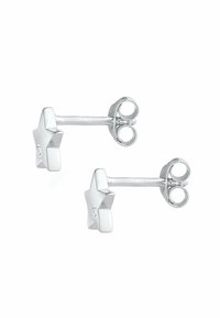 Pendientes de stud en forma de estrella plateada con un acabado suave y una pequeña piedra de acento en el centro, que cuentan con un cierre tradicional de presión.