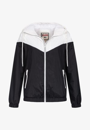 Black and white windbreaker jacket with a hood, featuring a front zipper, elastic cuffs, and two zippered side pockets. Lightweight material.