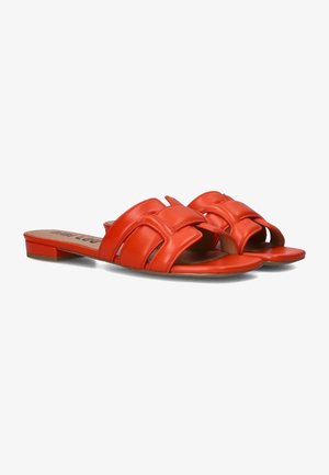 Red leather slide sandals with a flat, open-toe design featuring multiple cross straps and a smooth texture.