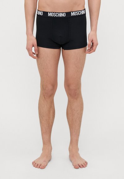 Black boxer briefs with a white Moschino logo waistband. Features a snug fit and smooth texture. No patterns or additional accents visible.