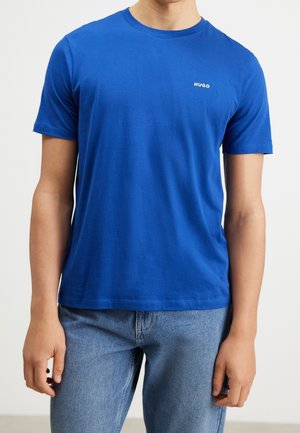 Blue cotton T-shirt with a crew neckline and short sleeves. Features a small white "HUGO" logo on the left chest. Smooth texture.