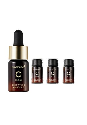 Dark brown bottles with black caps labeled Medicube Deep Vita C Ampoule, 14.5% vitamin C, one large dropper bottle and three smaller bottles.