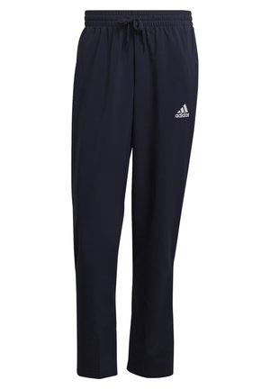 Schwarze Adidas-Trainingshose mit elastischem Bund und Kordelzug, mit dem weißen Adidas-Logo am rechten Oberschenkel.