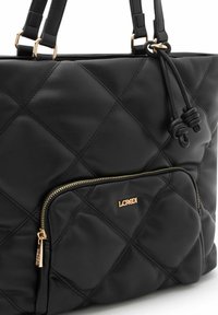 Black quilted tote bag made of synthetic material, featuring gold hardware, a front zippered pocket, and dual shoulder straps.