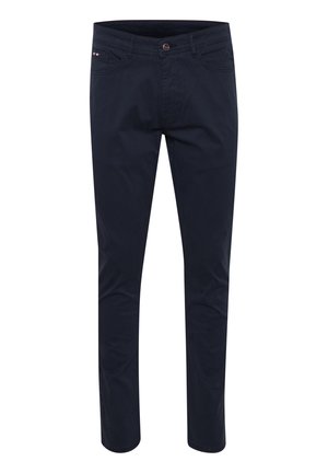 Navy siniset puuvillahousut, joissa on kapea malli, vetskari, viisi taskua ja pieni logo etuosassa. Silkkinen pinta.