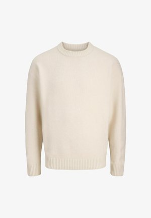 Pull en mélange de coton crème avec un col rond à côtes, des épaules tombantes et des poignets et un ourlet côtelés. Texture douce avec une coupe décontractée.