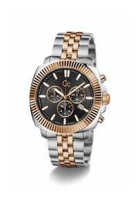 Nerūsējošā tērauda pulkstenis ar divkrāsainu rozā zelta un sudraba toņu aproci, melnu ciparnīcu un hronogrāfa subciparnīcām. Datums tiek rādīts pulksten 6.