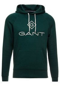 Sudadera verde de tela de mezcla de algodón, con un bolsillo delantero, capucha con cordón y texto y acentos en blanco.