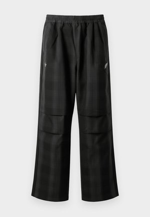 Schwarze karierte Hosen mit elastischem Bund, zwei Fronttaschen und lockerer Passform im geraden Beinschnitt. Hergestellt aus leichtem Material.