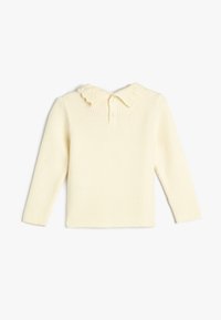 Ribbet crèmfarget langermet skjorte med volangkrage og tre-knaps placket på baksiden. Myk tekstur og tettsittende design.
