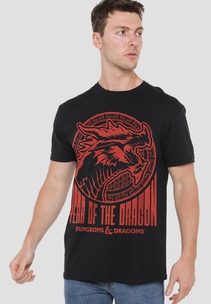 Black cotton t-shirt featuring a red dragon graphic and text "Year of the Dragon" from Dungeons & Dragons, with short sleeves and a crew neckline.