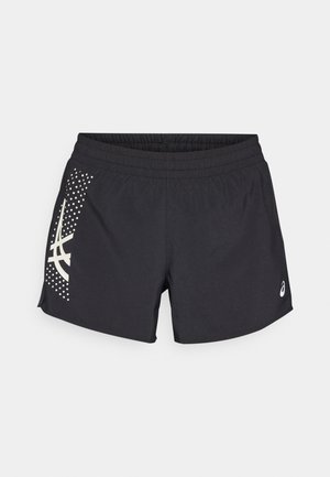 Fekete sportnadrág elasztikus derekkal és logóval. Az oldalán fehér részletekkel és pöttyös mintával rendelkező dizájn található.