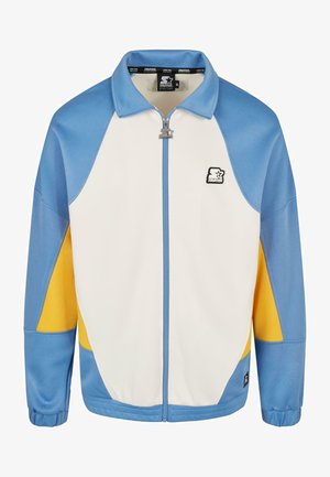 Modrá, biela a žltá športová bunda so zipsom. Má zaoblený golier, textilnú štruktúru a akcent s logom na hrudi.