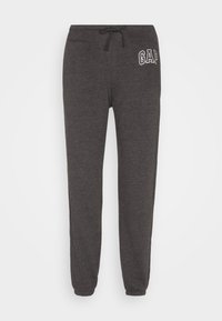 Dunkelgraue Jogginghose mit elastischen Bündchen und Bund, Kordelzug und weißem "GAP"-Logo an der linken Hüfte.