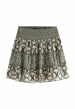 Tiered black skirt with beige floral pattern and smocked elastic waistband, featuring alternating large and small flower designs.