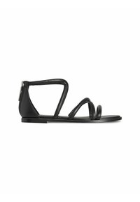 Sandales plates noires au design minimaliste. Elles présentent plusieurs fines lanières courbes et une fermeture éclair à l'arrière. Texture en cuir lisse.