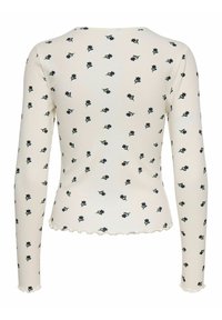 Długorękawowy ribbed top w kolorze kremowym z kwiatowym nadrukiem. Posiada falbaniasty dół i mankiety, z małymi niebieskimi i zielonymi wzorami kwiatów.